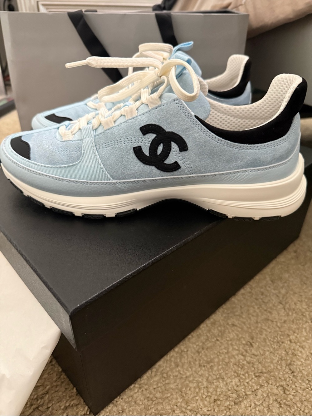 CHANEL Light Blue Suede CC Logo Sneakers with Black Accents.